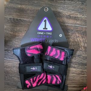 Black and Pink zebra print wrist guards.